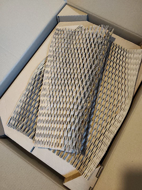 Protective packaging around a framed print